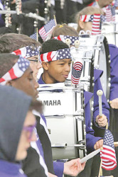 Sophomore bass drummer Rakwan Manns practices with the marching band, prior to trip. Photo by MATT GENTRY